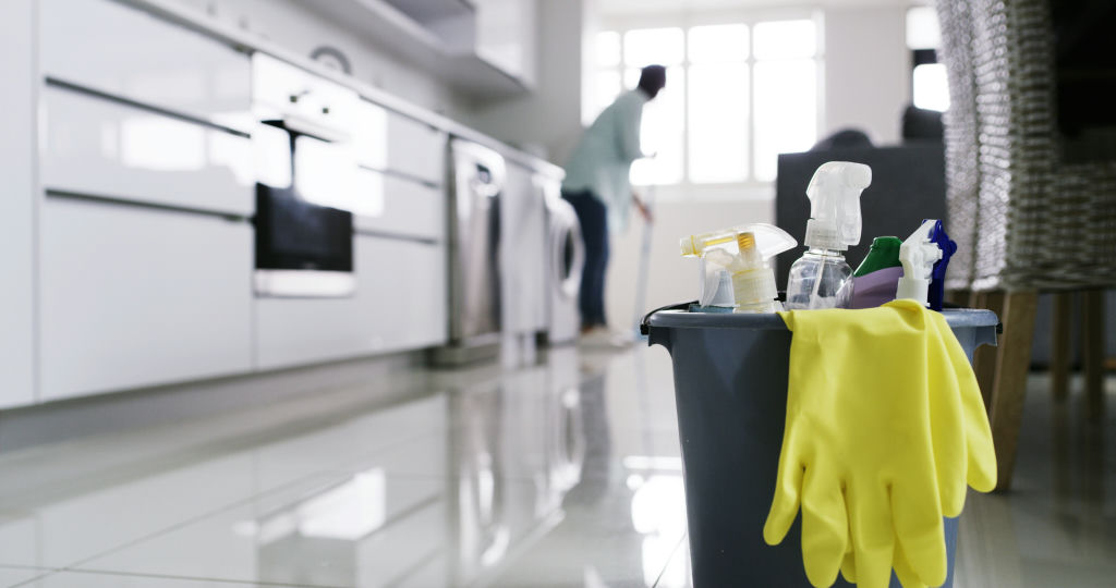 Sash & Co. Cleaning — cleaner mopping a bright kitchen floor